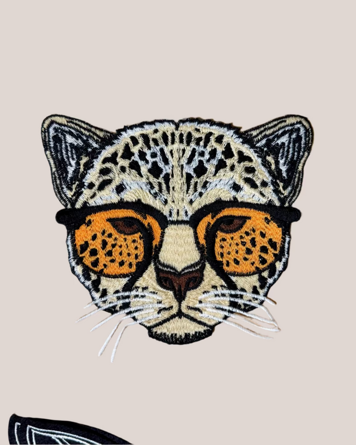 Large leopard in sunnies embroidered iron on patch sold by Le Monkey House