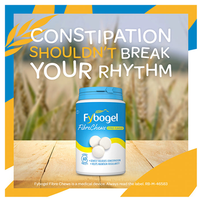 Fybogel FibreChews Citrus Flavour 60 Tablets blue and white tub on wooden surface, wheat field background, blue and yellow border