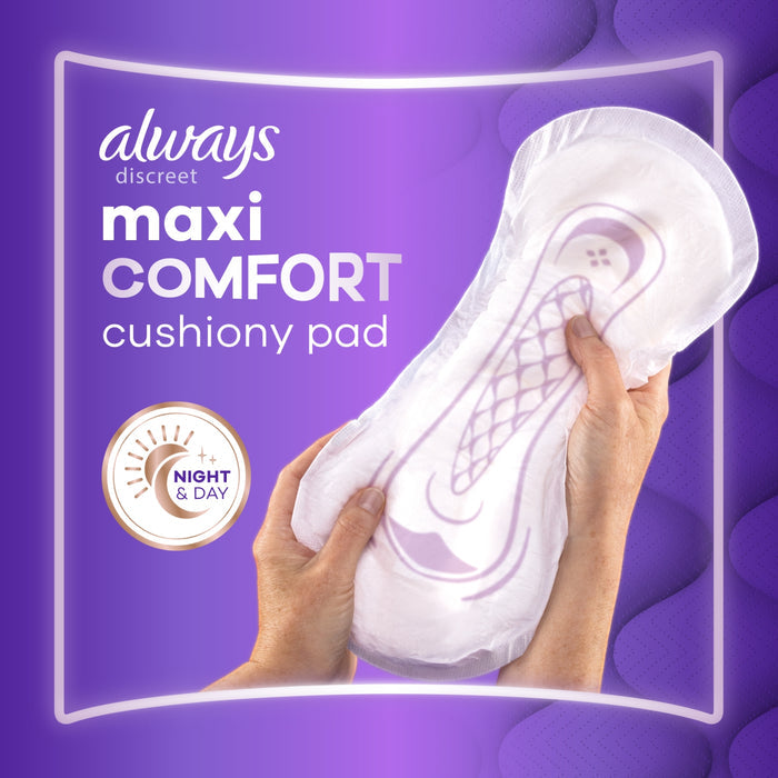 Always Discreet Maxi Comfort cushiony pad held by two hands on purple background, Night & Day badge visible.