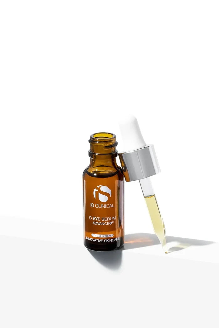 Amber glass bottle of iS Clinical C Eye Serum Advance+ with white dropper and pale yellow serum