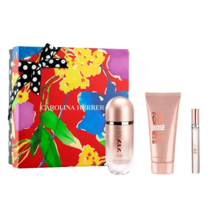 Carolina Herrera 212 VIP Rosé gift set with EDP spray, body lotion, and mini spray beside floral box on white background