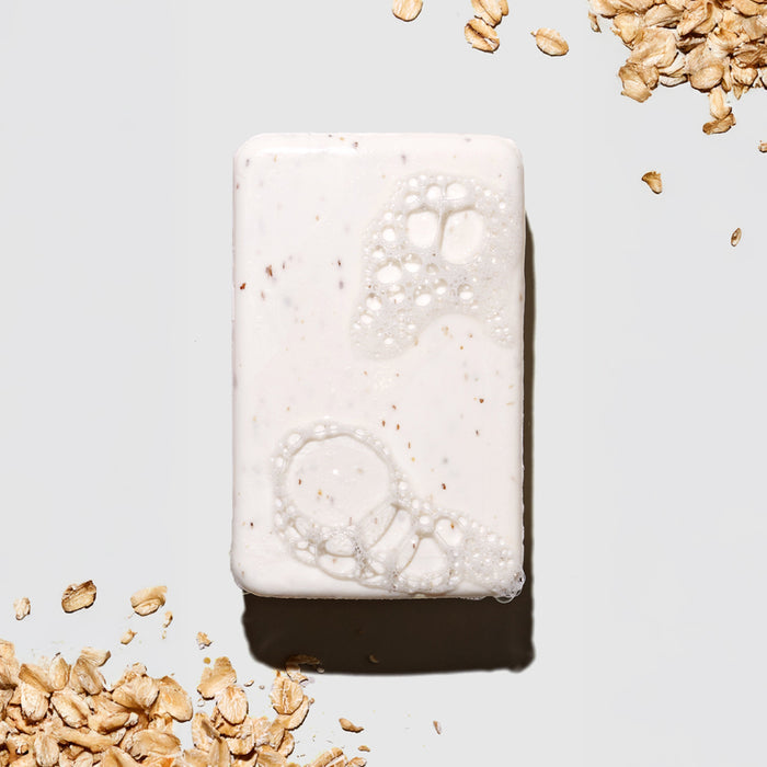 Bar of soap with oatmeal on a light background