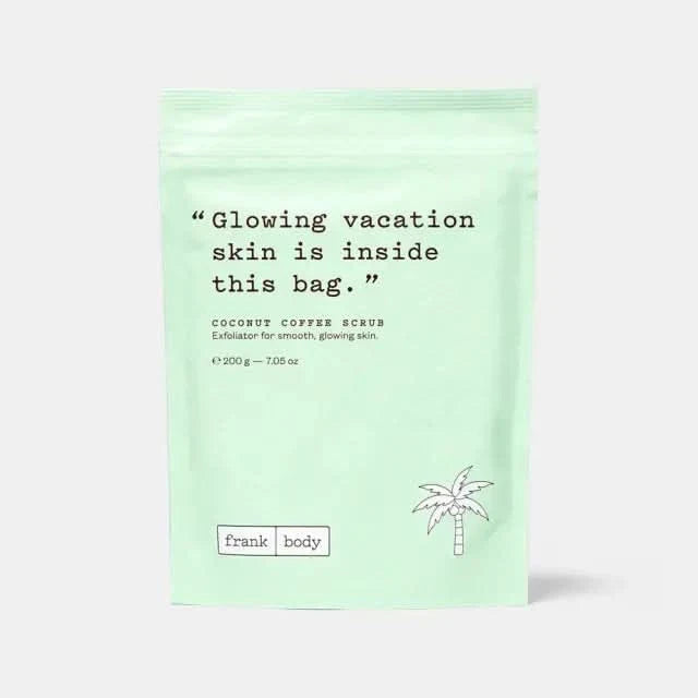 Frank Body Coconut Coffee Scrub 200g in mint green resealable pouch with palm tree illustration on light grey background.