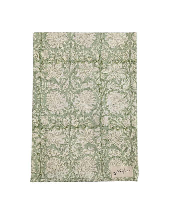 Floral patterned fabric with a brand label on a white background
