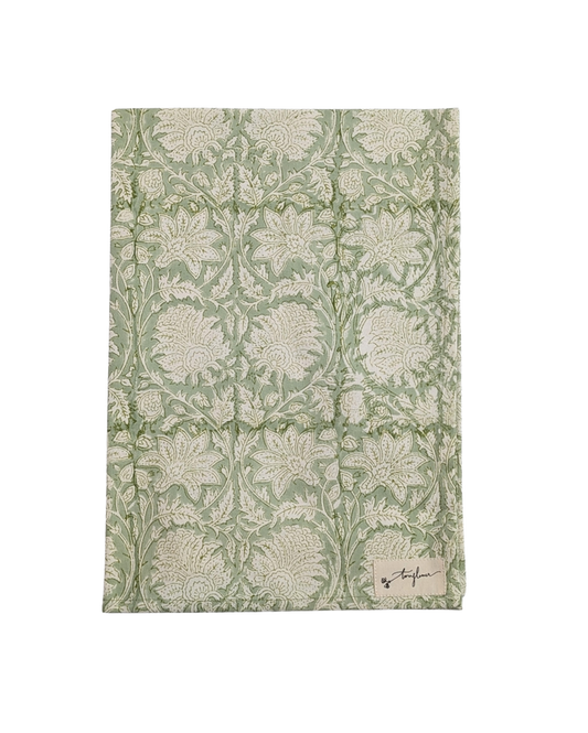 Floral patterned fabric with a brand label on a white background