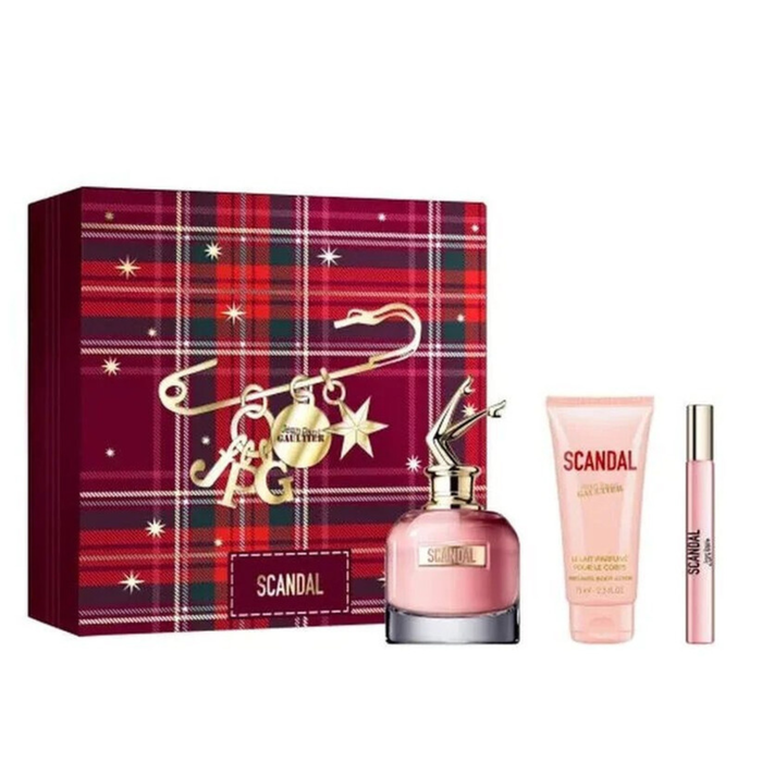 Jean Paul Gaultier Scandal gift set with EDP bottle, body lotion tube and mini spray beside red tartan box on white background.