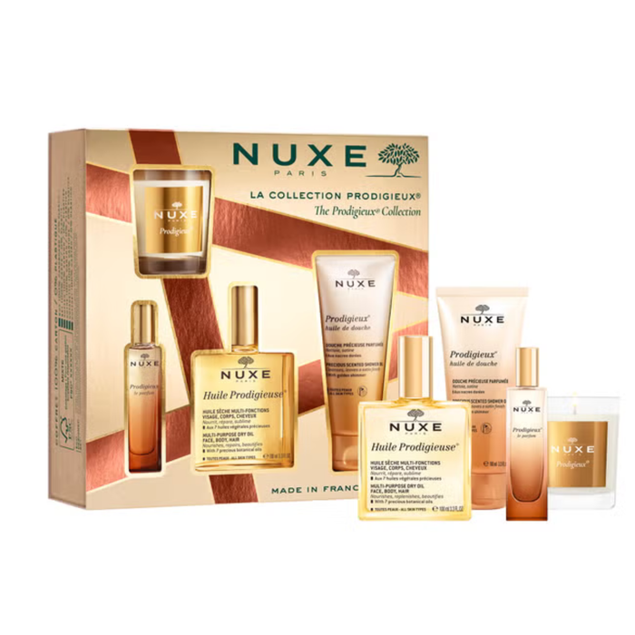 Nuxe Prodigieux 4 Piece Gift Set gold box with Huile Prodigieuse oil, shower gel, perfume and candle on white background