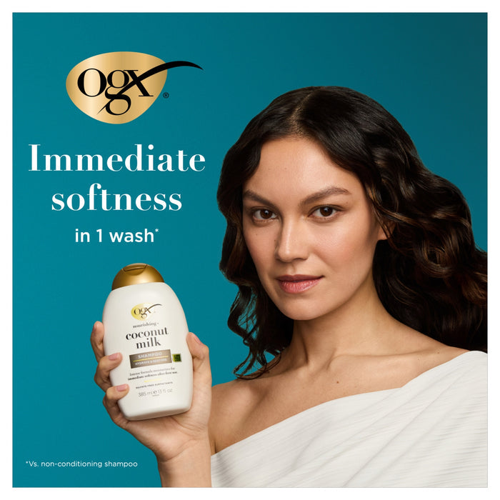 OGX Nourishing+ Coconut Milk Shampoo 385ml bottle held by woman with dark wavy hair on teal background, text reads "Immediate softness in 1 wash"