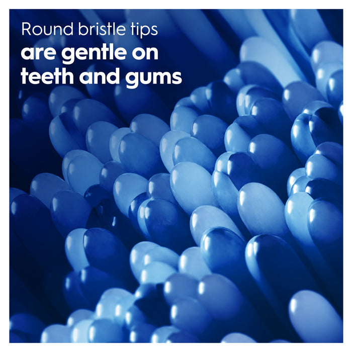 Oral-B Pro Clean Pulsar close-up of blue rounded bristle tips on blue background. Text reads "Round bristle tips are gentle on teeth and gums"