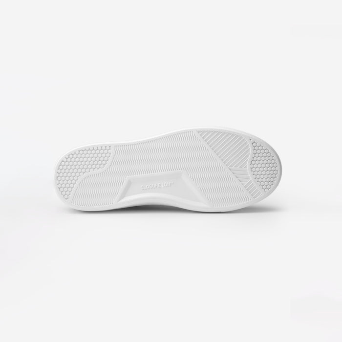 Sole view of the Premium Classic Trainer in black, showing the textured Closure LDN custom outsole and embossed branding.