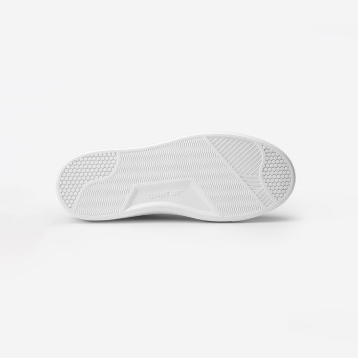 Sole view of the Premium Classic Trainer in charcoal, showing the textured Closure LDN custom outsole and embossed branding.