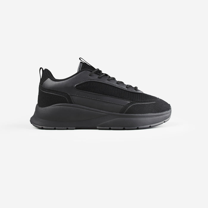 Side shot of premium runner trainer in all black shot on white background