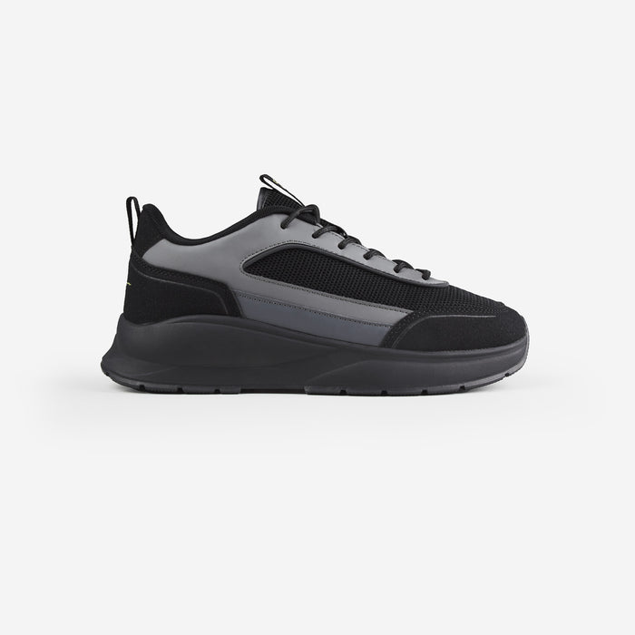 Side shot of black runner trainer with chunky sole shot on white background