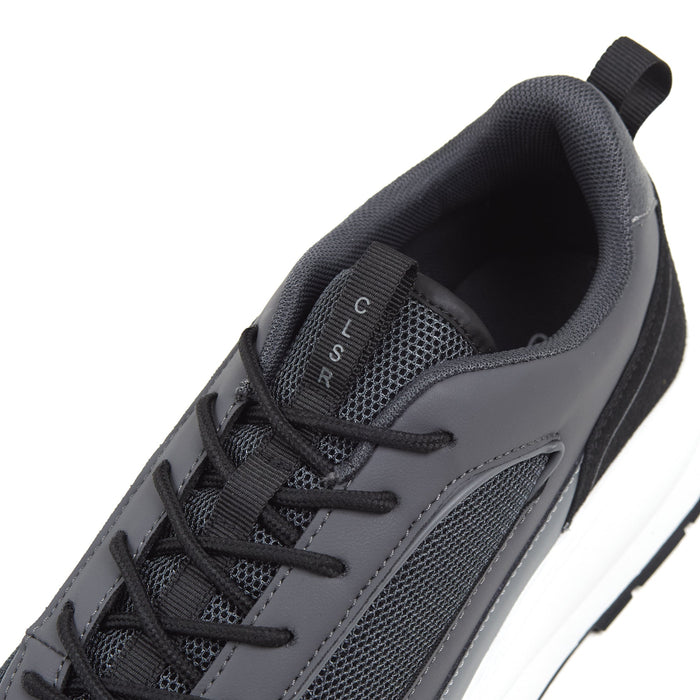 Close up shot of black premium runners showing CLSR writing on tongue strap