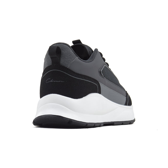 Black runner trainer shot from behind on white background