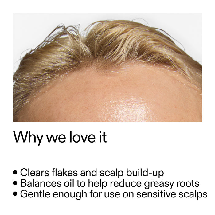 Close-up of a person's scalp with text highlighting Salicylic Acid Exfoliating Scalp Treatment benefits