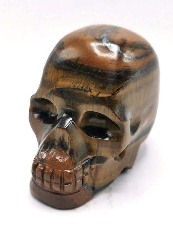 Skull in natural tiger eye stone - reiki/chakra/healing - crystal crafts - weight 132 gm (0.29 lb) and 2 inches