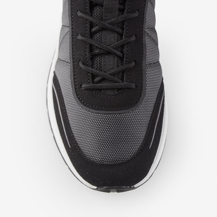 Close up of smart runner trainers in black showing mesh detailing
