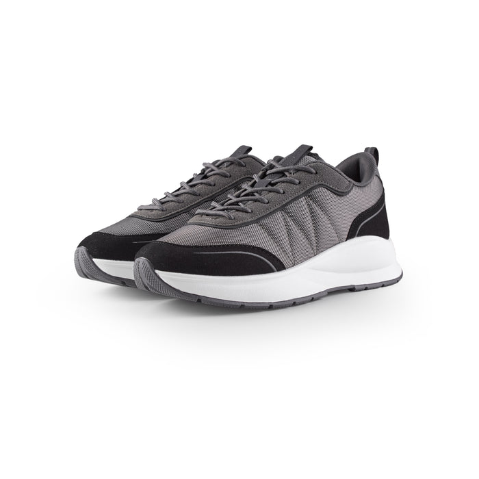 Pair of smart runner trainers in charcoal shot on white background
