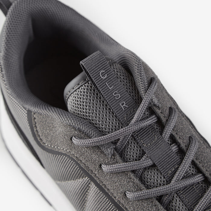 Close up shot of smart runner trainer in charcoal showing tongue strap detailing