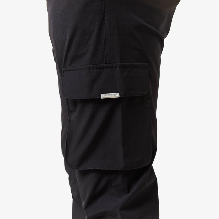 Close up of cargo pants pocket in black with closure london logo