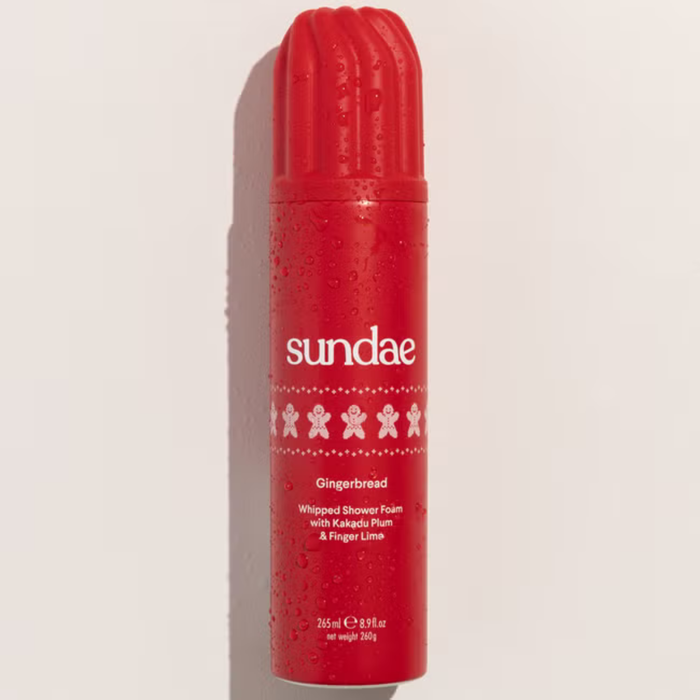 Sundae Gingerbread Shower Foam 265ml red canister with water droplets, showing gingerbread man icons on cream background.