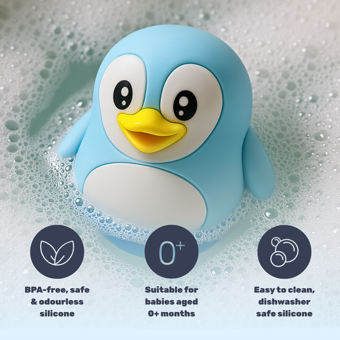 TensCare Digi Penguin Bath Thermometer floating in soapy water, blue penguin figure, text: "BPA-free, suitable for babies 0+ months, dishwasher safe"