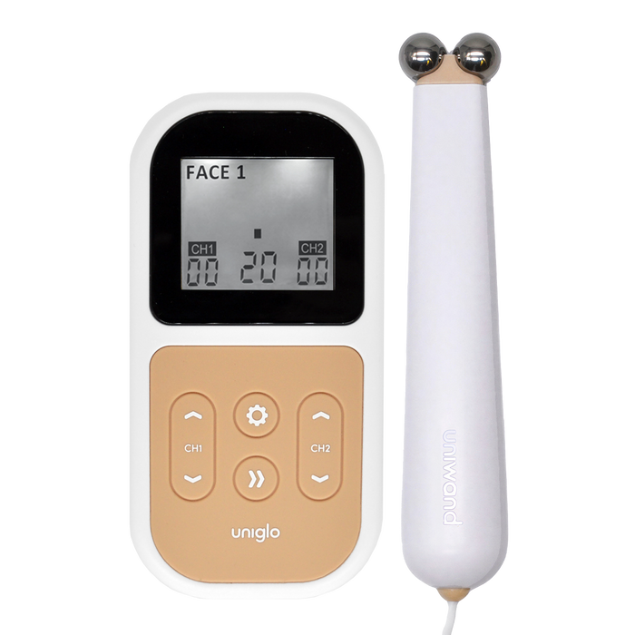 TensCare Uniglo device with LCD showing "FACE 1" and Uniwand massager with dual metal balls, white and gold, on white background.
