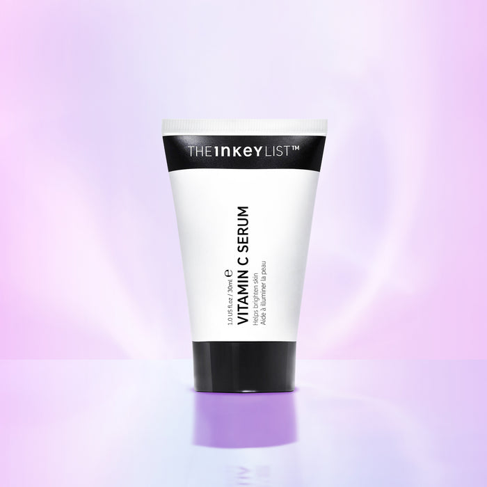 Vitamin C Serum tube on pink background