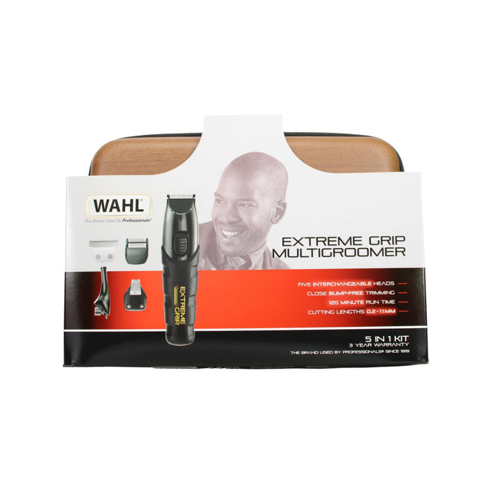 Wahl Extreme Grip Multigroomer 5-in-1 kit packaging on white background, showing black trimmer with attachments and brown storage case.
