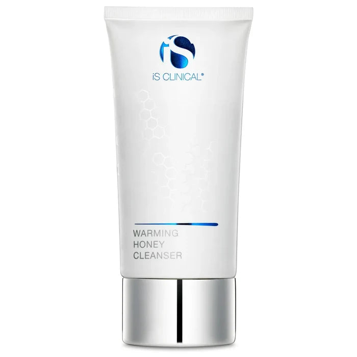 White tube of iS Clinical Warming Honey Cleanser with silver cap and blue logo on white background