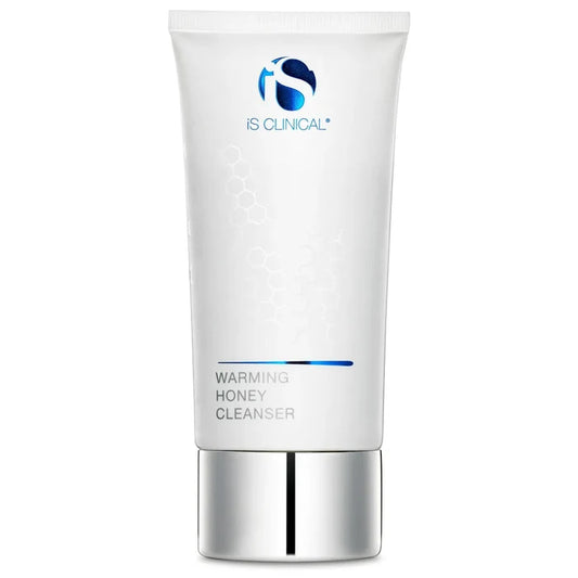 White tube of iS Clinical Warming Honey Cleanser with silver cap and blue logo on white background